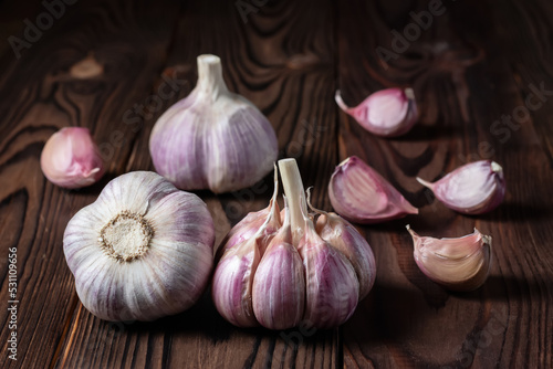 Garlic bulb on wooden background. Close up