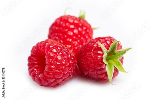 Closeup of red raspberry berries on white background