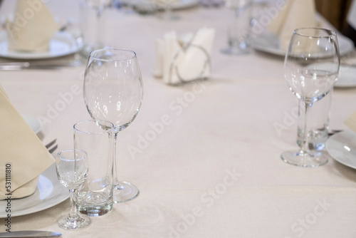 Banquet table with wineglasses. High angle of elegant banquet table served for wedding celebration