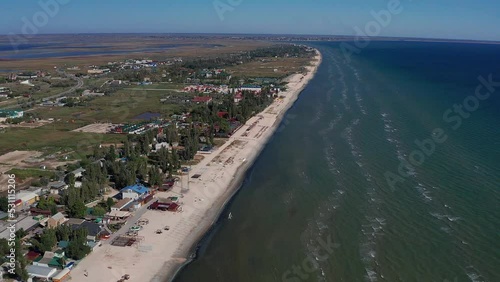 Wallpaper Mural Beautiful flight in summer over the beach. People are resting near the sea. Houses for tourists. Beach umbrellas, rides, people swimming in the sea. Torontodigital.ca