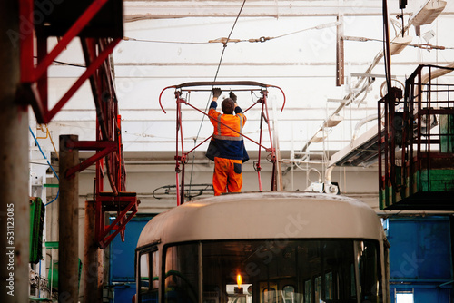 Tram in service depot. Maintenance and repairing of pantograph photo