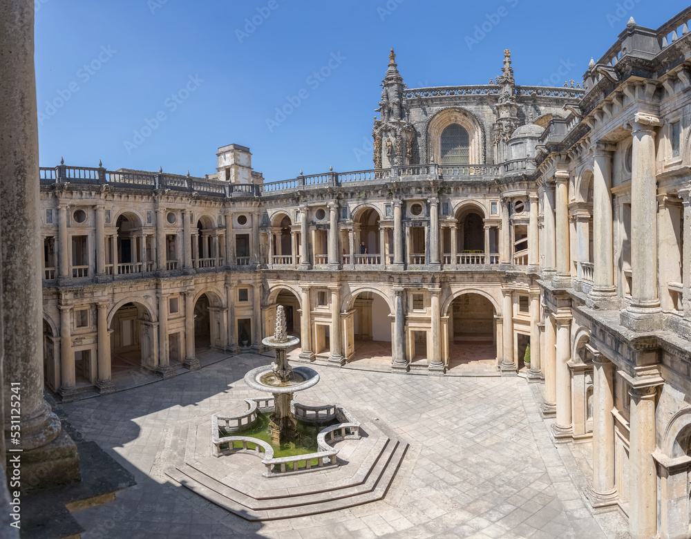 View at the Renaissance main cloister, with ornamented fountain in the middle, an iconic piece of the Portuguese renaissance type, on Convent of Christ, Tomar