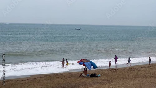 Group of people enjoying their summer holiday on the beach photo