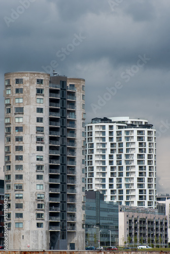 Modern apartment buildings  Dark skies above - Stock Photo