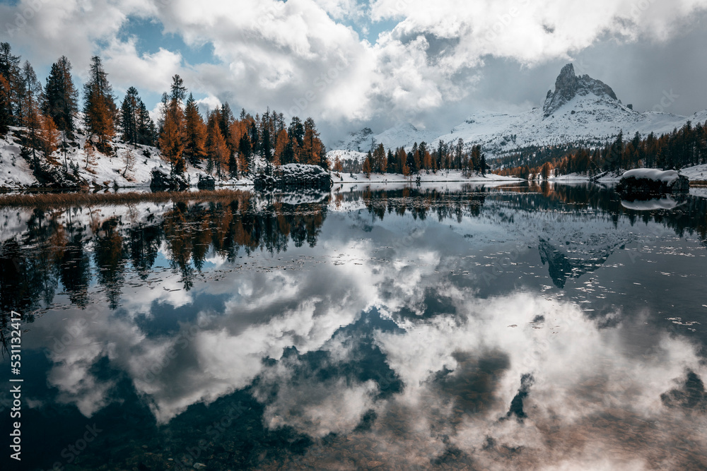 Fototapeta premium morning by the lake in the late autumn snow covered mountains in italian alps