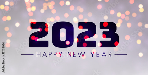 Banner with 2023 happy new year sign on sweaty grass.