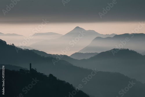 misty layers of mountains in the morning at sunrise © Francesca Emer