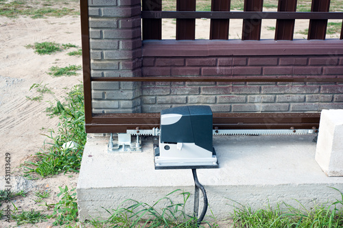 Electric garage door opener installed in garage