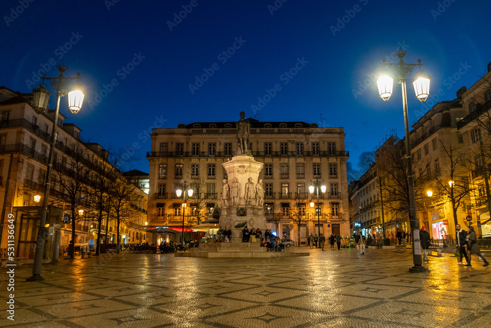 Lisbon, Portugal. April 11, 2022: Square of the poet Luís de Camões at night. Lisbon, Portugal. April 11, 2022: Square of the poet Luís de Camões at night.
