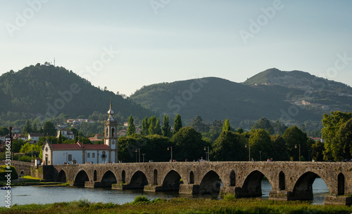ancient roamn bridge in the village of ponte de lima portugal photo