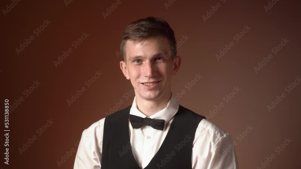portrait of a young happy caucasian male waiter smiling. close-up portrait of a young happy caucasian male waiter smiling. close-up
