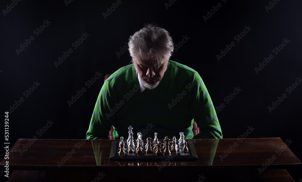 grandmaster in a suit playing chess grandmaster in a suit playing chess