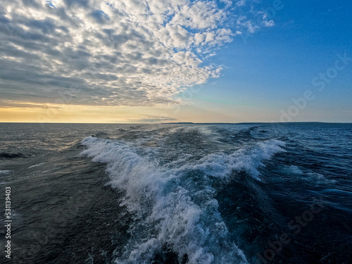 Boat Waves and Wake over Lake Superior Looking Back to a Beautiful Horizon.