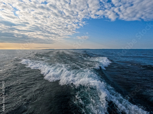 Boat Waves and Wake over Lake Superior Looking Back to a Beautiful Horizon.