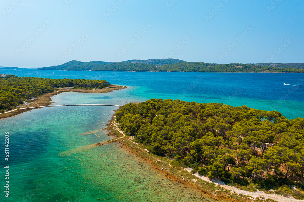 Aerial view about Otok Školjić next to St. Nicholas Fortress (Croatian: Tvrđava sv. Nikole) which located at the entrance to St. Anthony Channel, near the town of Šibenik in central Dalmatia, Croatia.