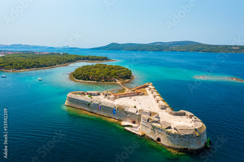 Aerial view about St. Nicholas Fortress (Croatian: Tvrđava sv. Nikole) which located at the entrance to St. Anthony Channel, near the town of Šibenik in central Dalmatia, Croatia.