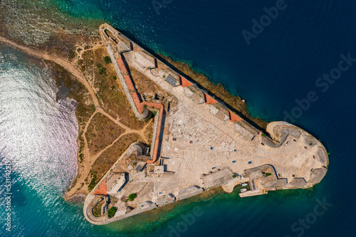 Aerial top down view about St. Nicholas Fortress (Croatian: Tvrđava sv. Nikole) which located at the entrance to St. Anthony Channel, near the town of Šibenik in central Dalmatia, Croatia.