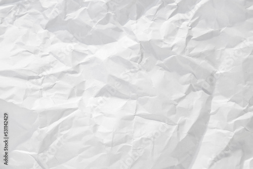 Background for design with space for text or image. White crumpled paper texture background.
