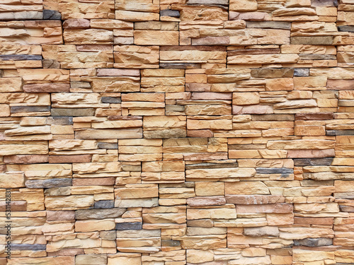 Artificial stone cladding. Designed to resemble real stone. Arranged vertically and attached to the wall with a special adhesive. Used as decoration on the walls of buildings. 
