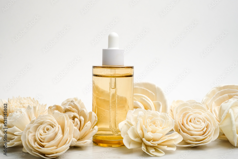 Beauty product or skincare packaging with white flower on white background .modern and minimal concept. Beauty product or skincare packaging with white flower on white background .modern and minimal concept.