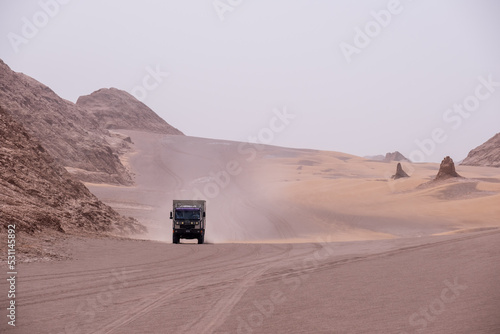 Truck camper in the middle of a sand storm