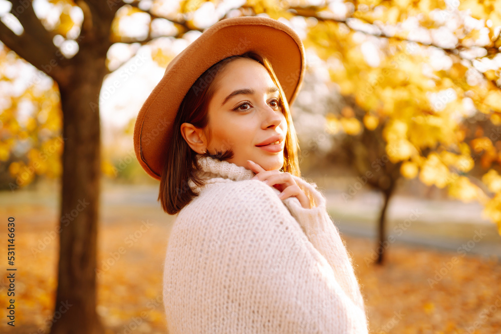 Young woman resting in nature. Autumn. People, lifestyle, relaxation and vacations concept. 