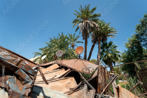 Rusty burned shops in the town of Sidi Harazem