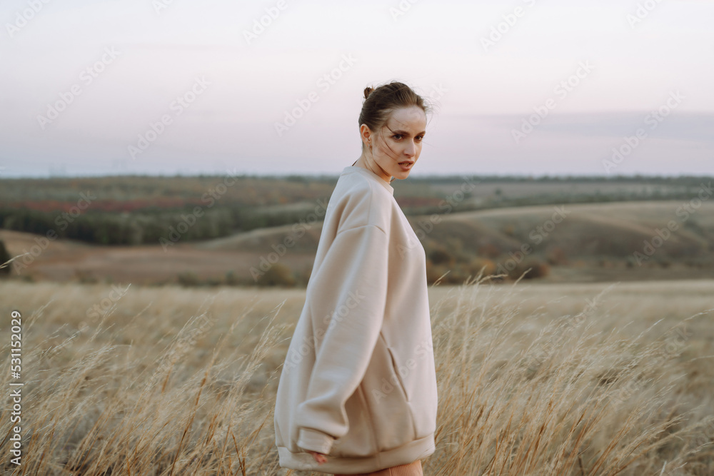 Stylish woman enjoying autumn weather outdoor. Fashion, style concept. People, lifestyle, relaxation and vacations concept. Stylish woman enjoying autumn weather outdoor. Fashion, style concept. People, lifestyle, relaxation and vacations concept.