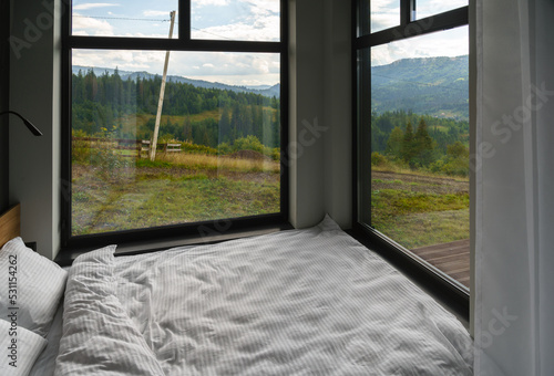 Big bed with panoramic view on Carpathian mountains in Ukraine