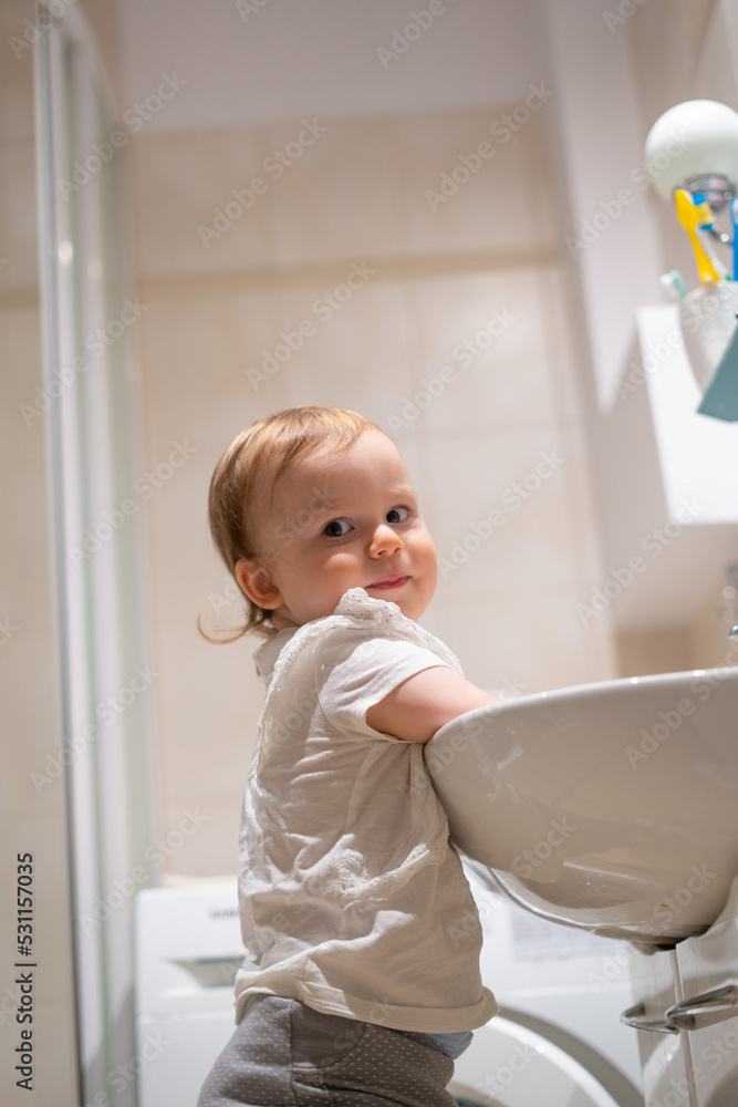 The child independently washes his hands in the bathroom. Prevention of infectious diseases, flu and coronavirus. The child independently washes his hands in the bathroom. Prevention of infectious diseases, flu and coronavirus.