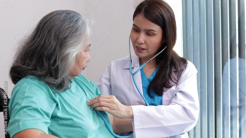 Asian female doctor uses a stethoscope to examine elderly patients suffering from depression She was sitting in a wheelchair. The concept of senior patients. Elderly Health Care Center Asian female doctor uses a stethoscope to examine elderly patients suffering from depression She was sitting in a wheelchair. The concept of senior patients. Elderly Health Care Center