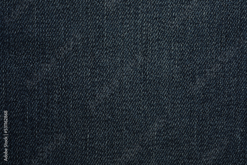 Texture of dark blue jeans as background, closeup © New Africa