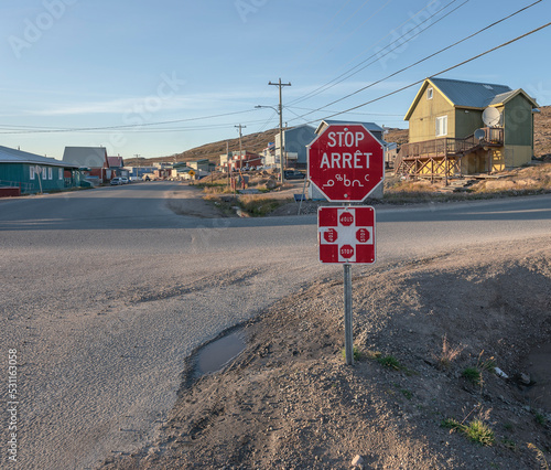 Four way stop sign written in English, French and Inuktitut in Iqaluit, Nunavut 