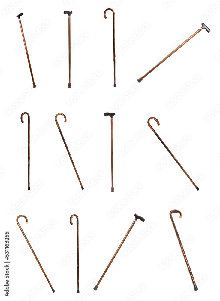 Set with elegant wooden walking canes on white background Set with elegant wooden walking canes on white background