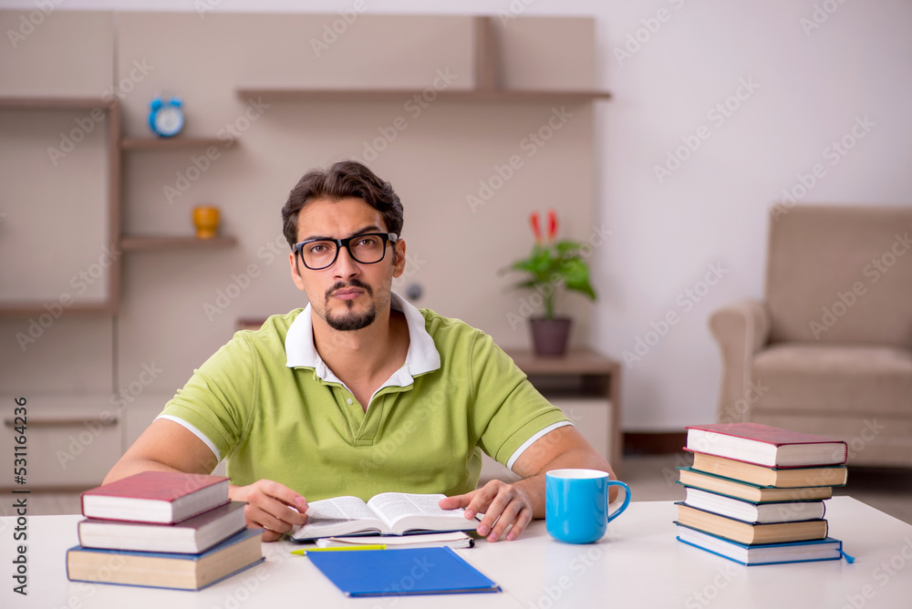 Young male student studying at home Young male student studying at home