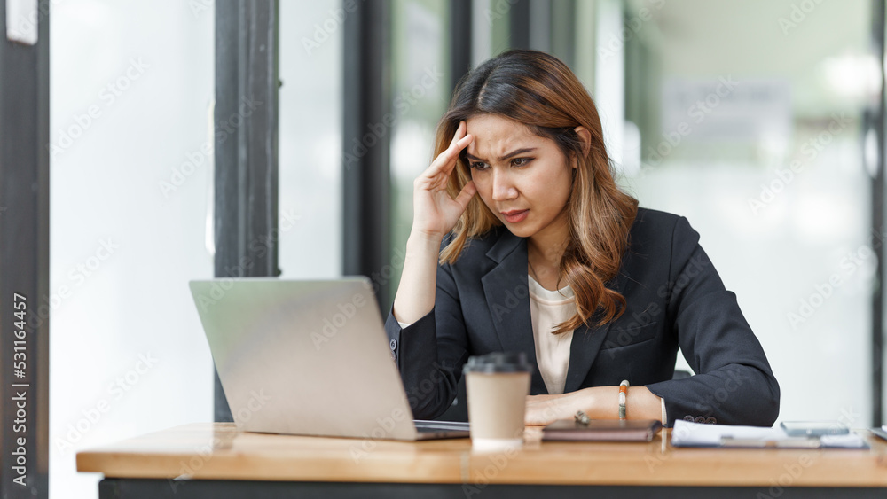 Stress asian business woman after working hard at office workplace. Stress asian business woman after working hard at office workplace.