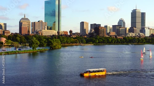 Boston, MA USA - 08 30 2022: Tour boat on Charles river, and Boston Downtown
