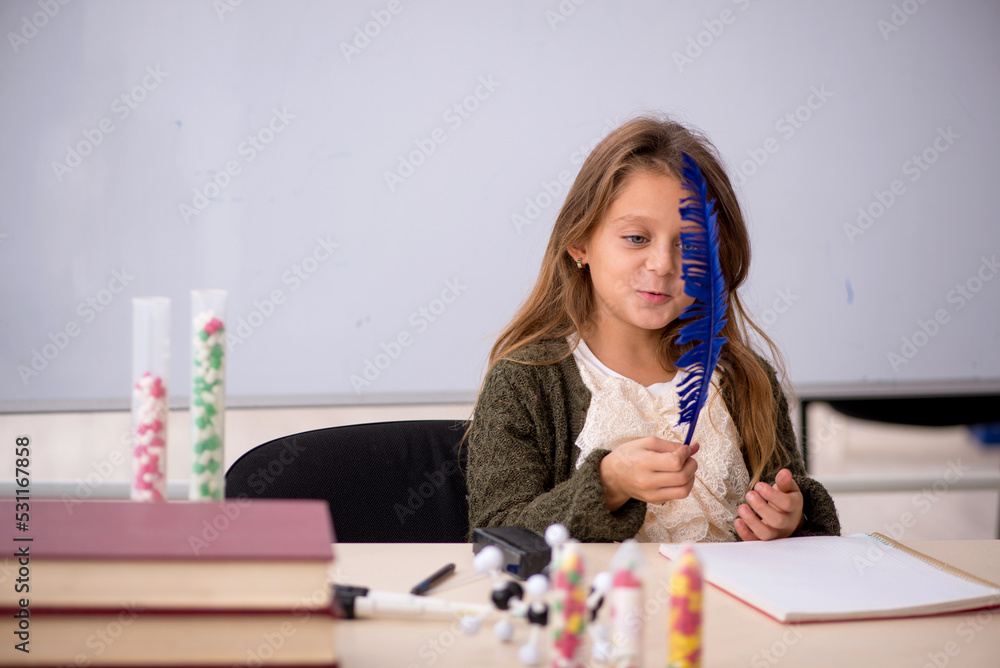 Young little girl chemist in drugs synthesis concept Young little girl chemist in drugs synthesis concept