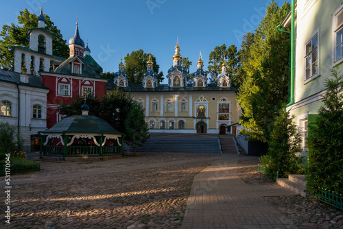 View of the Assumption Cathedral, the Great Belfry and the sacristy in the Holy Dormition Pskov-Pechersk Monastery on a sunny summer day, Pechory, Pskov region, Russia