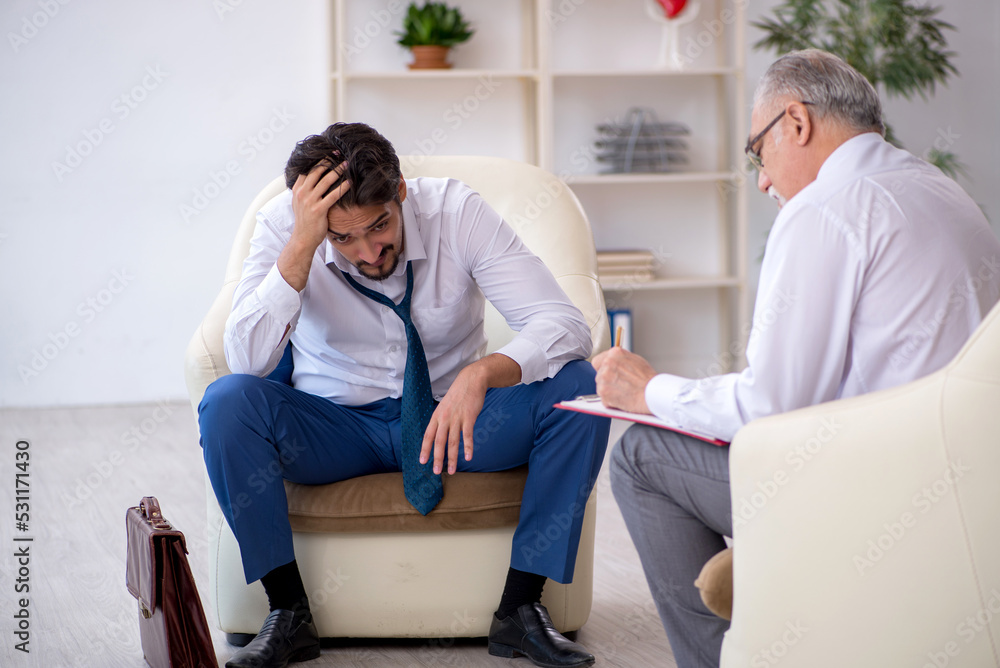 Young businessman employee visiting psychologist Young businessman employee visiting psychologist
