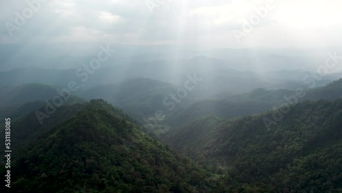 mountain ridge and clouds in rural jungle bush forest. Ban Phahee, Chiang Rai Province, Thailand photo