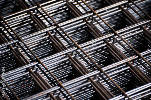 Stacked welded wire mesh in cold plant storehouse macro view photo