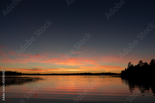 Fading sunset glow at dusk over northern lake scene for magazine newsletter advertising layout design © Rob Schultz