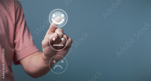 Customer service satisfaction concept, Young businessman touching happy face screen, smile satisfaction rating icon face. 