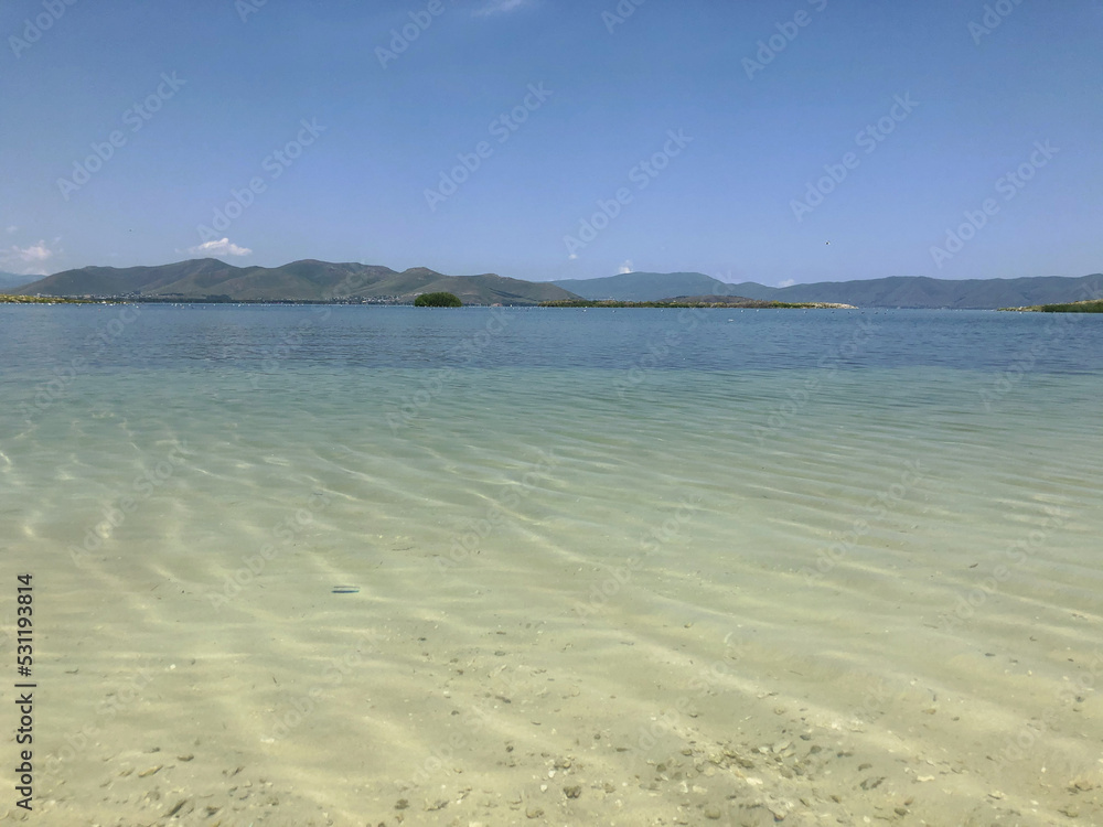 A pond with clear transparent water. Mountain Lake.  Lake Sevan in Armenia.