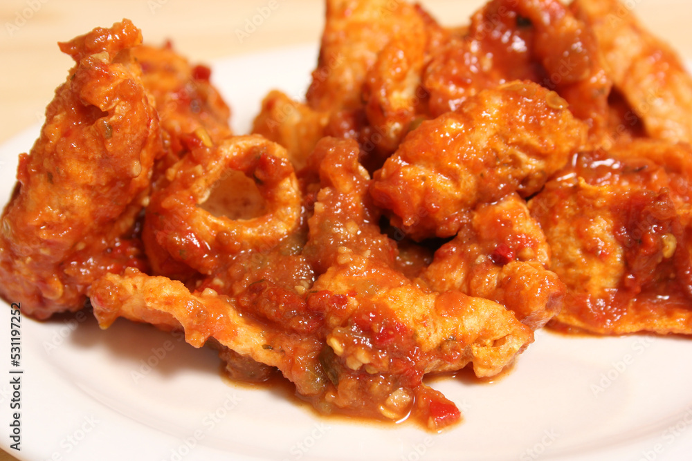 Fried Pork Skins With Red Salsa in Rustic Kitchen Fried Pork Skins With Red Salsa in Rustic Kitchen
