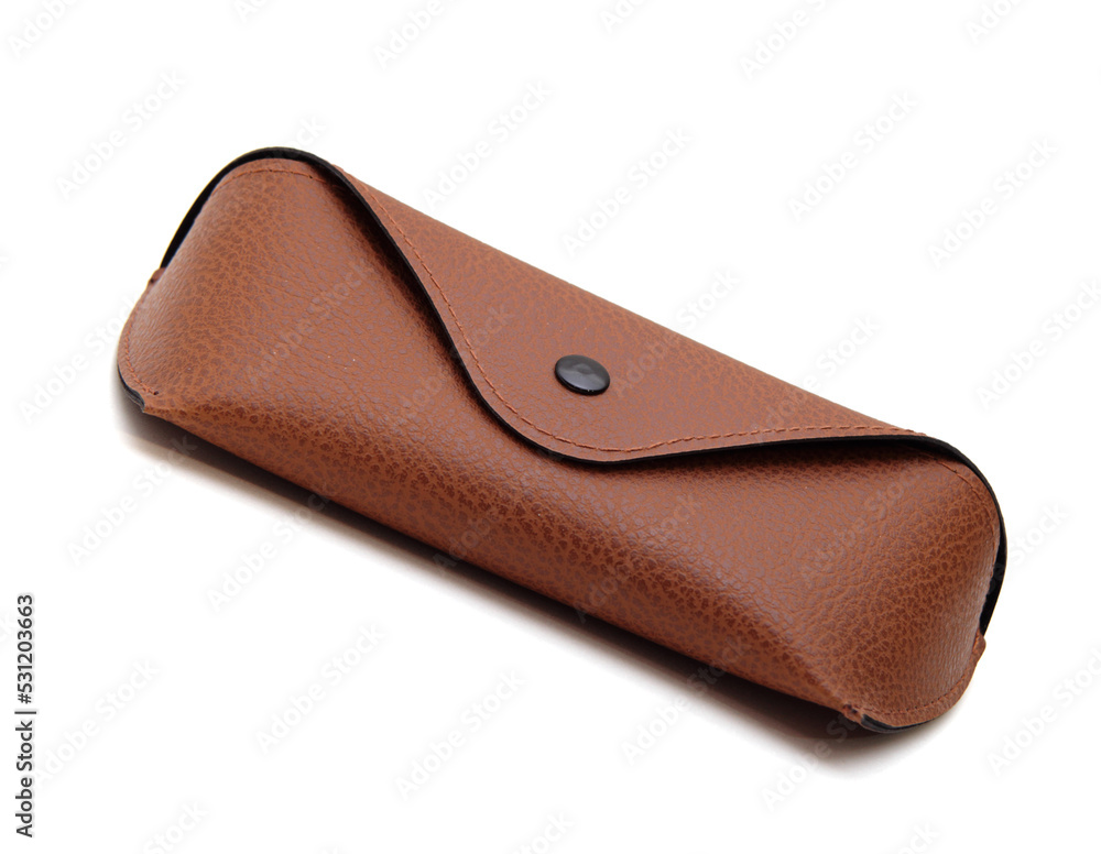 Case for storing glasses, brown, with a button, on an isolated white background Case for storing glasses, brown, with a button, on an isolated white background