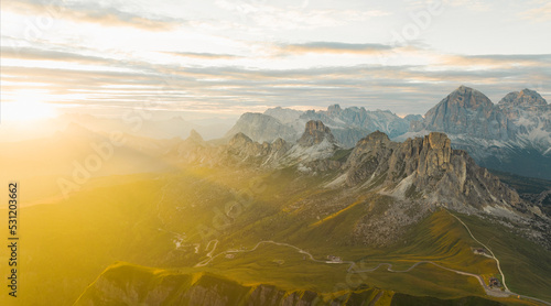 View from above, stunning aerial view of the Giau pass during a beautiful sunset. The Giau Pass is a high mountain pass in the Dolomites in the province of Belluno, Italy