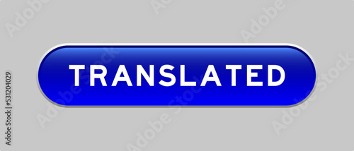 Blue color capsule shape button with word translated on gray background