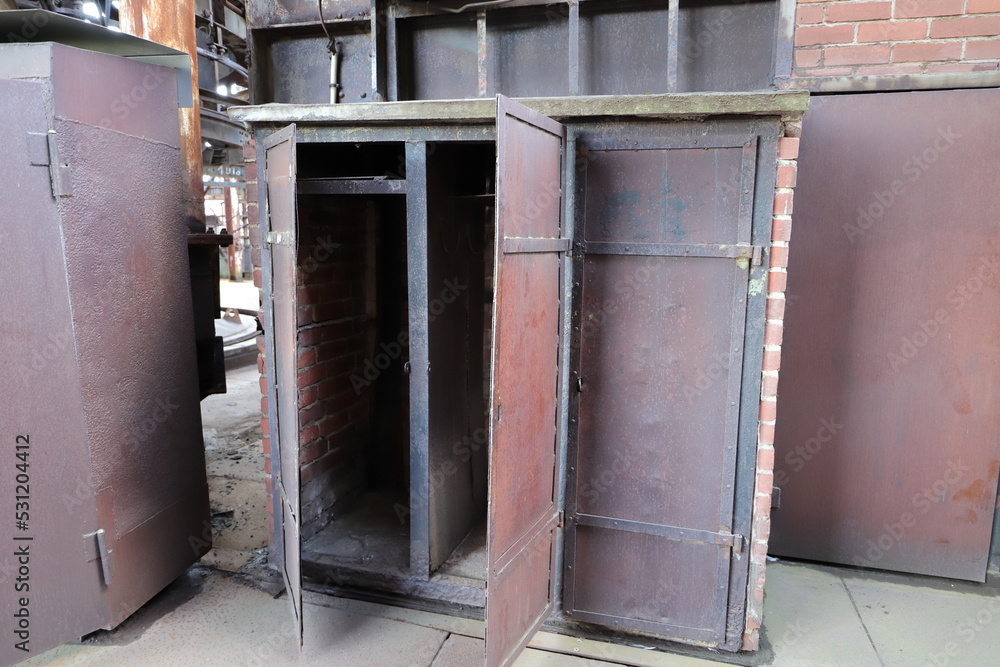 an old rusty open metal cupboard